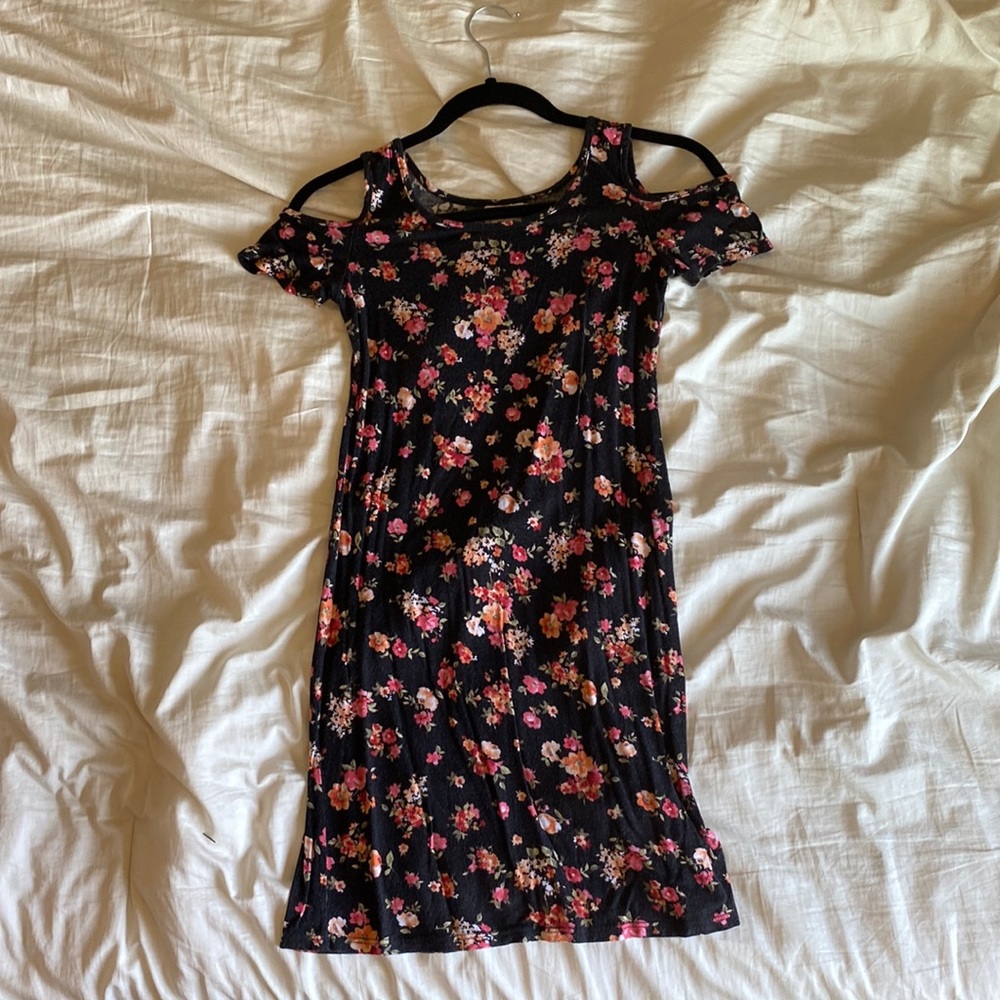 Black and floral dress with shoulder cutouts. Brand: h.i.p. Size: XS